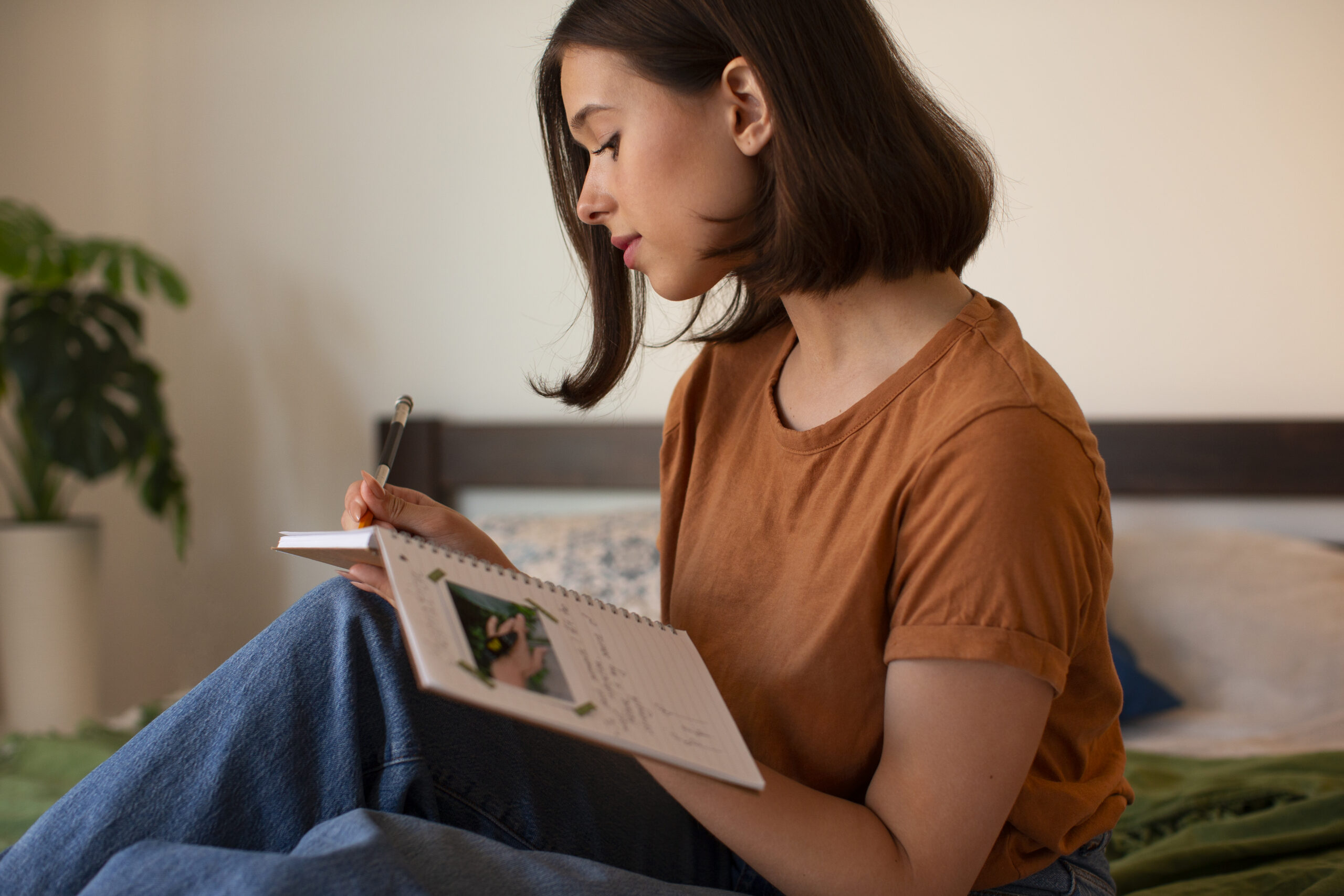 side-view-woman-doing-creative-journaling