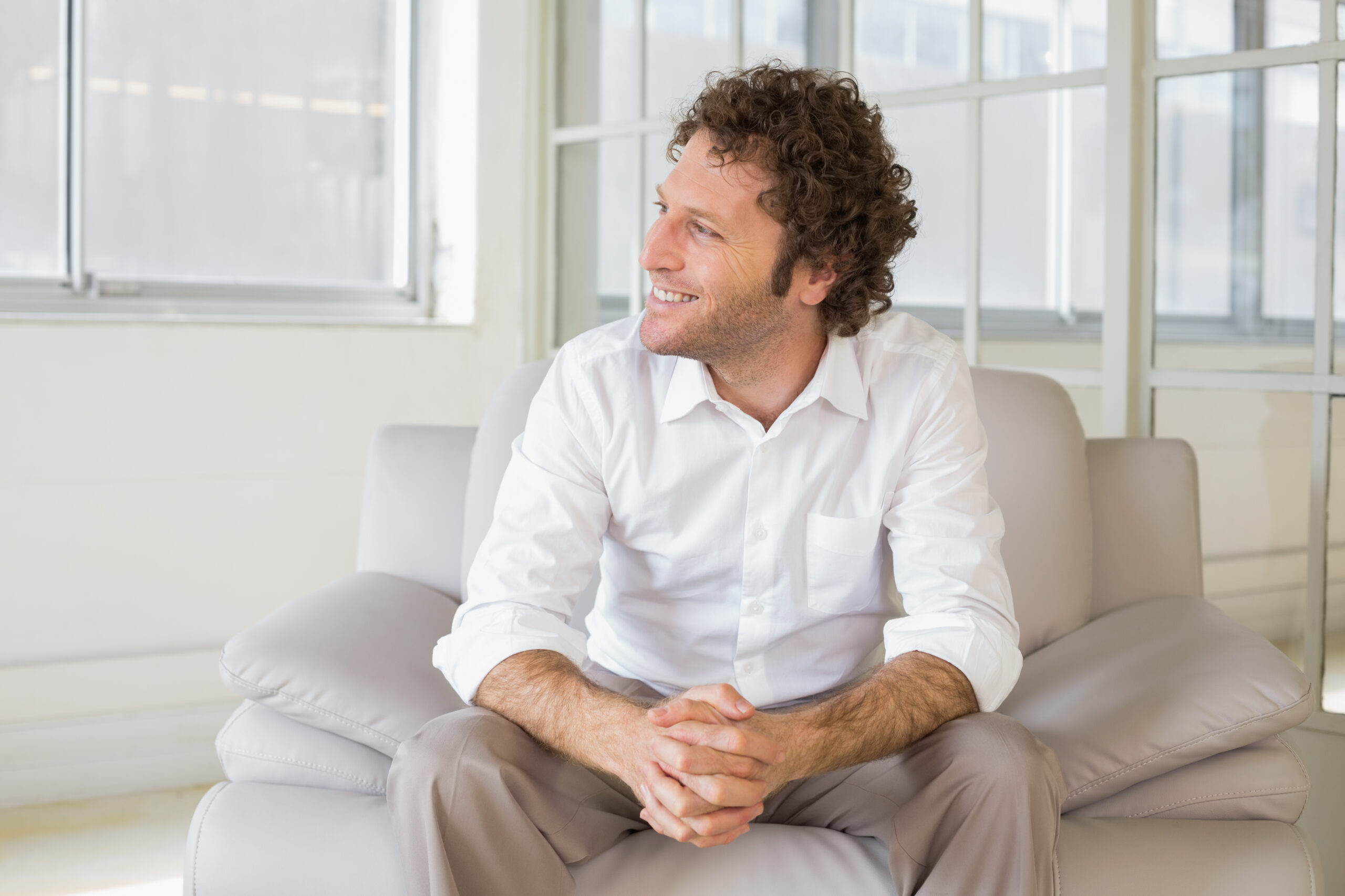 relaxed-well-dressed-man-sitting-home-scaled.jpg